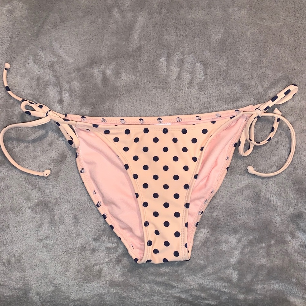 Baby pink, navy pocka dotted swim suit bottoms.